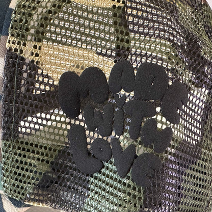 Loveville “H❤️MAN” Trucker Hat – Camo