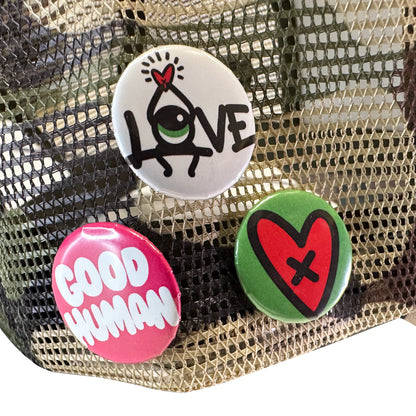 Loveville “H❤️MAN” Trucker Hat – Camo